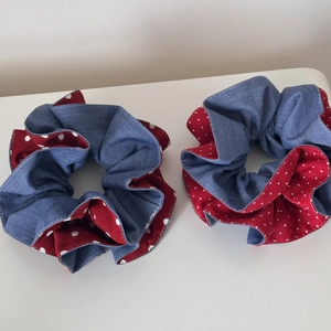 Detailed view of dual-color denim blue and red polka dot pattern scrunchies set