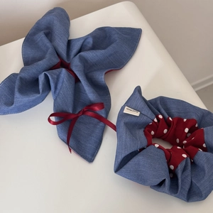 Detailed shot of retro denim blue and red scrunchie set with white polka dots