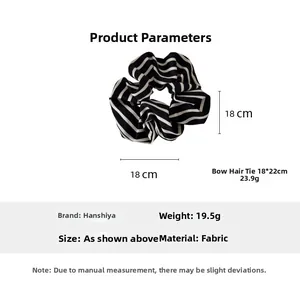 Detail of black and white striped oversized scrunchie showing 18cm diameter and fabric texture