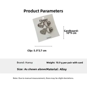 Detail view showing dimensions of heart-shaped hair clips with polka dots and stripes