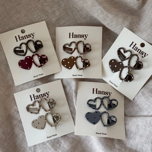 Set of 5 heart-shaped polka dot and striped hair clips on elegant display cards