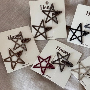 Set of two cute polka dot star hair clips with resin finish and duckbill grip for women