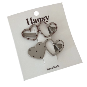 Polka dot and plaid heart hair clip set on display card for stylish hair styling