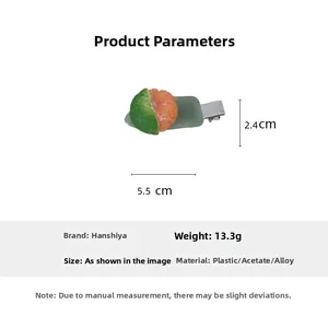 Detailed view of orange slice hair clip showing dimensions 5.5x2.4cm and weight 13.3g