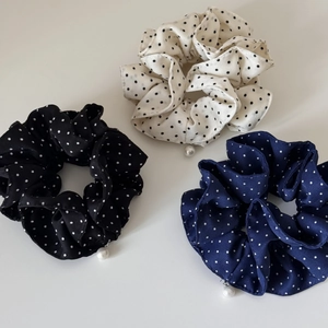 Three-piece polka dot scrunchies set with elegant pearl charms in black, cream, and navy