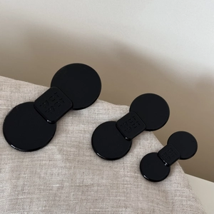 Three-piece set of acetate hair clips in black with 'wei wei' lettering detail