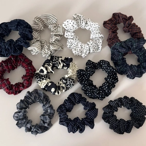 Flat lay of 10-piece elastic hair scrunchie set with polka dots and vintage patterns