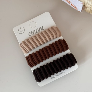 Three-pack ribbed high-elastic hair ties in beige, dark coffee, and black tones
