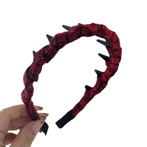 Punk style red plaid headband with black decorative spikes for voluminous hair