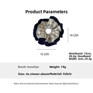 Detail of navy blue and white striped fabric scrunchie with dimensions 16cm by 16cm