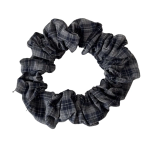 Classic dark grey tartan check scrunchie with pleated fabric texture and high elasticity