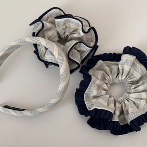 Detailed set of blue striped headband and large scrunchies with handmade label