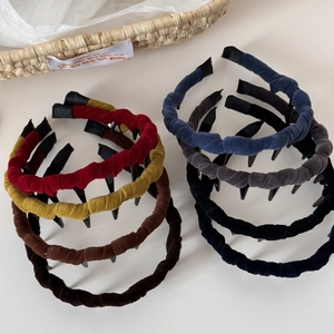 Detail view of colorful velvet wavy headbands with non-slip teeth for secure and soft fit