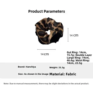 Detail showing 14cm leopard print scrunchie fabric texture and product specifications