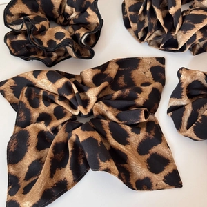 Set of leopard print satin scrunchie and bow headband with silky texture for hair