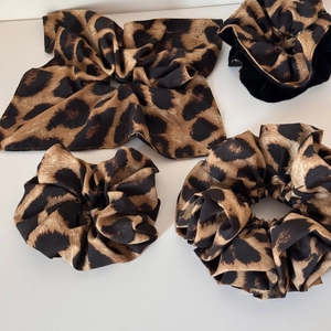 Set of leopard print scrunchies and bow headband made of smooth brown satin fabric