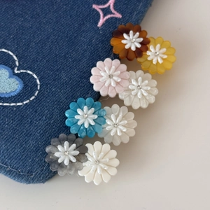 Colorful acetate daisy flower hair clips with sparkling crystal centers for girls