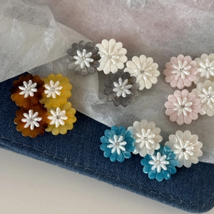 Sweet acetate daisy flower hair clips in various colors with rhinestone centers for women