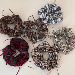 Detailed set of six plaid hair scrunchies with long ribbon bows in classic patterns