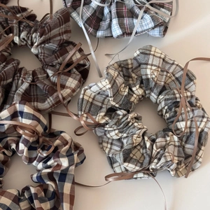 Plaid scrunchie hair ties with ribbon bows for balletcore aesthetic hair styling