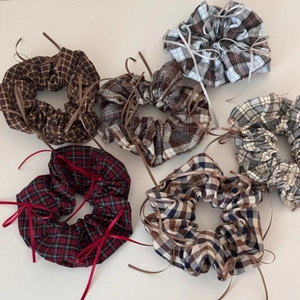 Set of six ballet-style plaid scrunchies with elegant ribbon bows in retro autumn colors