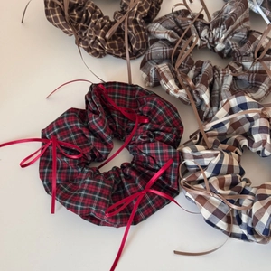 Ballet style plaid scrunchies with delicate ribbon bows in various retro colors