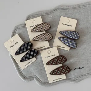 Set of eight teardrop hair clips with British plaid fabric patterns in assorted colors
