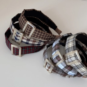 Detail showing various plaid headbands with vintage resin square buckles in multiple colors