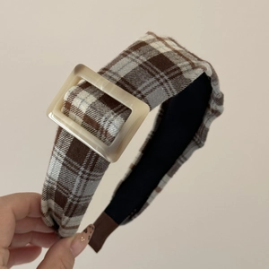 Detail of vintage brown plaid headband featuring a stylish beige square resin buckle