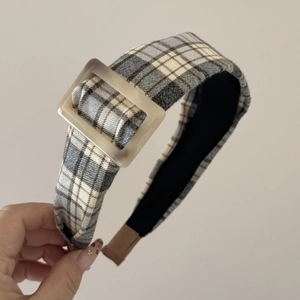 Detail view of American vintage brown plaid headband with a yellow square resin buckle