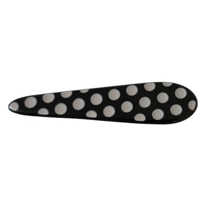 Japanese style black teardrop hair clip with white polka dots on a clean white background