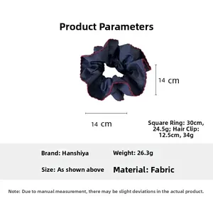 Detailed view of navy blue and red denim hair scrunchie showing 14cm diameter and 26.3g weight