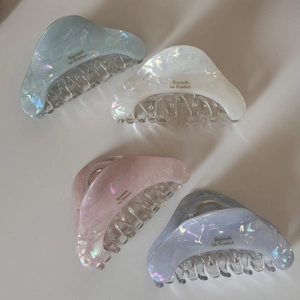Set of four iridescent triangle hair claws in pastel blue, white, pink and purple