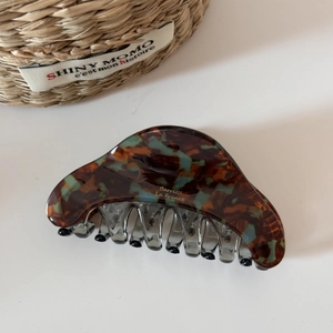 Detail of tortoiseshell acetate hair claw clip with gold Barrette La France lettering