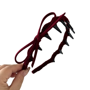 Elegant burgundy velvet headband with side bow and non-slip comb teeth for women