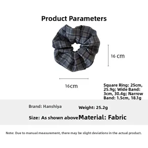 Detail view of blue plaid fabric scrunchie showing 16x16cm dimensions and weight info