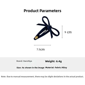 Detailed view of deep blue velvet bow clip with dimensions 7.5x9cm and 6.4g weight
