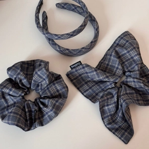 Blue plaid hair accessory set including a headband, scrunchie, and bow hair tie
