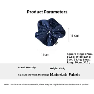 Detail of blue denim heart hair scrunchie showing 18cm diameter and 63.6g weight