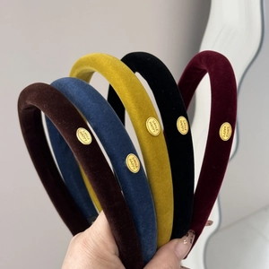 Narrow velvet headbands in five colors with premium gold metal smile label for women