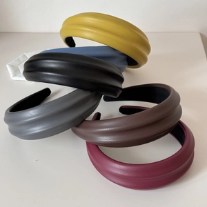 Set of six chunky padded PU leather headbands in assorted colors with a textured finish