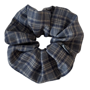 Elegant plaid scrunchie hair tie in navy blue and brown blend fabric with a woven label