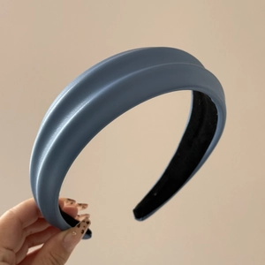 Detail of navy blue PU leather headband with thick sponge padding and non-slip inner lining
