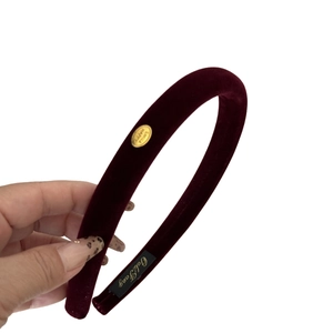 Premium burgundy velvet headband with a gold smile charm for autumn and winter outfits