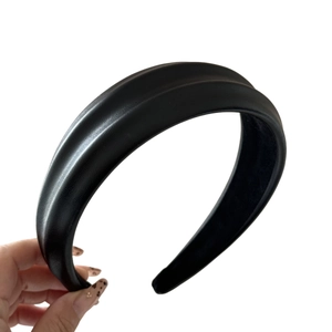 Elegant wide black PU leather headband with thick sponge padded texture for a high crown look