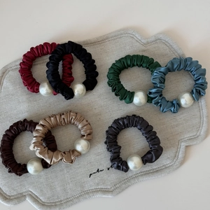 Set of 7 colorful satin scrunchies with white pearl beads for elegant hairstyling
