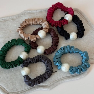 7-piece set of satin silk scrunchies with large pearls in assorted elegant colors