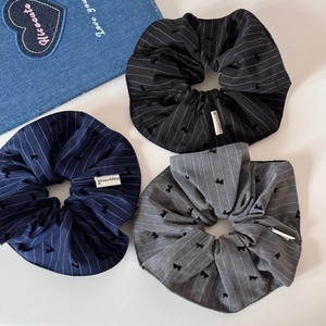 Three-piece set of large striped scrunchies with bow embroidery and Happiness labels