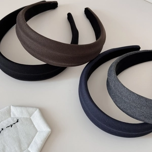 Padded wide headbands set in neutral tones with textured fabric and non-slip lining