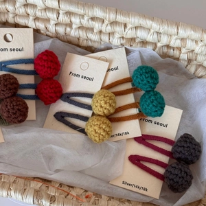 Handmade crochet colorful pom pom cherry hair clips for girls in various warm tones